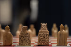 **Lewis chessman**

[Source](https://commons.wikimedia.org/wiki/File:British_Museum_-_Room_40_Lewis_Chess_Pieces_(20222522988).jpg)
