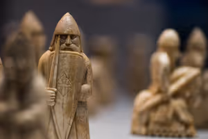 **Lewis chessman**

[Source](https://commons.wikimedia.org/wiki/File:British_Museum_-_Room_40_Lewis_Chess_Pieces_(20410506025).jpg)