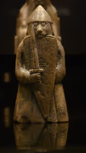 **Lewis chessman**

Exhibition in the National Museum of Scotland. Pieces from the British Museum, National Museum of Scotland and other collections. A warder (rook) with number of permanent collection NMS 29
[Source](https://commons.wikimedia.org/wiki/File:Lewis_chessmen_08.JPG)